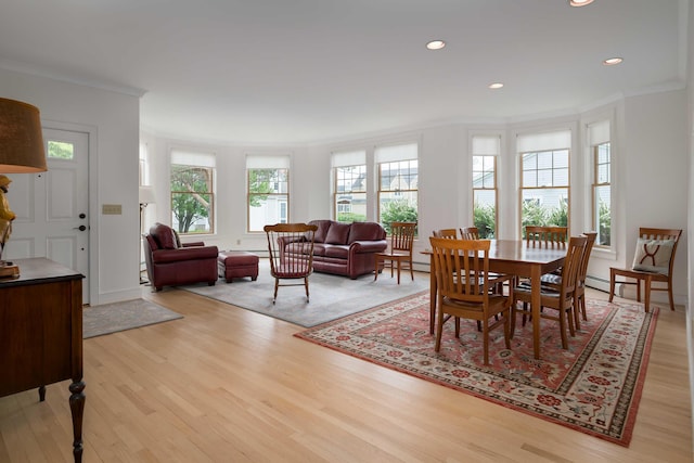 22 Saints Pl, Wells, ME 04090 - dining area featuring light wood-type flooring, crown molding, recessed lighting, and a baseboard heating unit