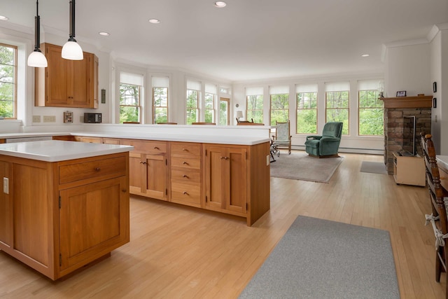 22 Saints Pl, Wells, ME 04090 - kitchen featuring light countertops, a peninsula, light wood finished floors, open floor plan, and recessed lighting