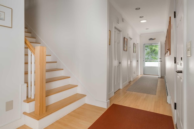 22 Saints Pl, Wells, ME 04090 - stairway with wood finished floors, recessed lighting, crown molding, and baseboard heating