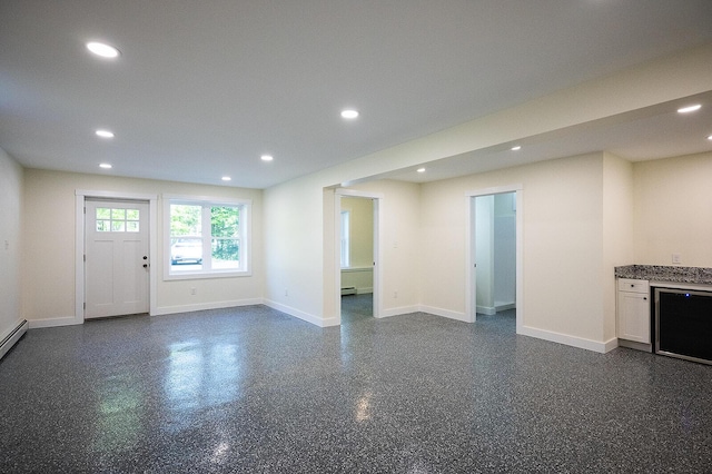 74 Hebron Rd, Paris, ME 04281 - unfurnished living room with recessed lighting, a baseboard radiator, baseboards, and wine cooler