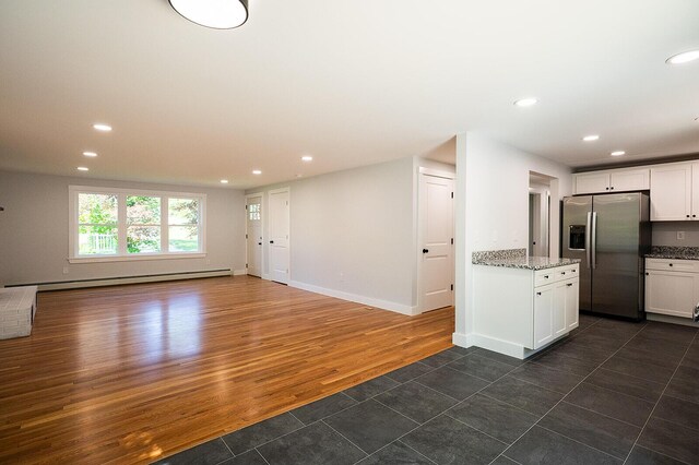 74 Hebron Rd, Paris, ME 04281 - kitchen featuring stainless steel refrigerator with ice dispenser, a baseboard radiator, recessed lighting, white cabinets, and dark tile patterned flooring