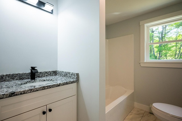 74 Hebron Rd, Paris, ME 04281 - bathroom featuring vanity, marble finish flooring, toilet, baseboards, and tub / shower combination