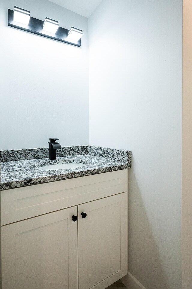74 Hebron Rd, Paris, ME 04281 - bathroom with vanity and baseboards