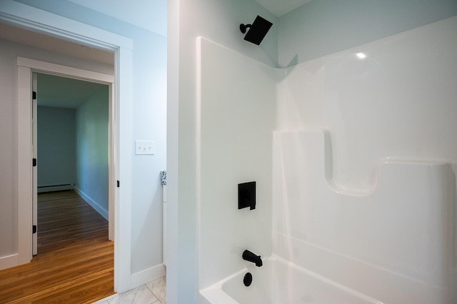 74 Hebron Rd, Paris, ME 04281 - full bathroom featuring a baseboard radiator, washtub / shower combination, and baseboards
