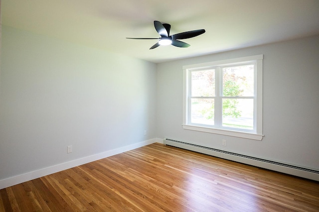 74 Hebron Rd, Paris, ME 04281 - empty room with baseboard heating, wood finished floors, ceiling fan, and baseboards