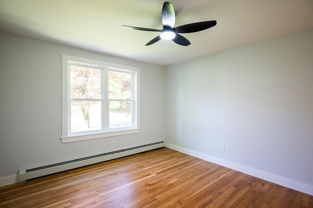 74 Hebron Rd, Paris, ME 04281 - spare room with baseboard heating, a ceiling fan, light wood finished floors, and baseboards