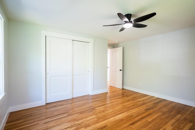 74 Hebron Rd, Paris, ME 04281 - unfurnished bedroom featuring a closet, light wood-type flooring, baseboards, and ceiling fan