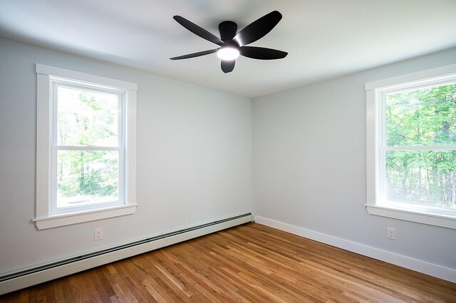74 Hebron Rd, Paris, ME 04281 - spare room with baseboard heating, wood finished floors, a ceiling fan, and baseboards