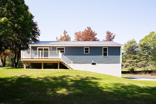 74 Hebron Rd, Paris, ME 04281 - rear view of property with a deck, stairs, a lawn, and metal roof