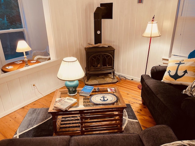 12 Spruce Gum Ln, Georgetown, ME 04548 - living room featuring a wood stove and hardwood / wood-style floors