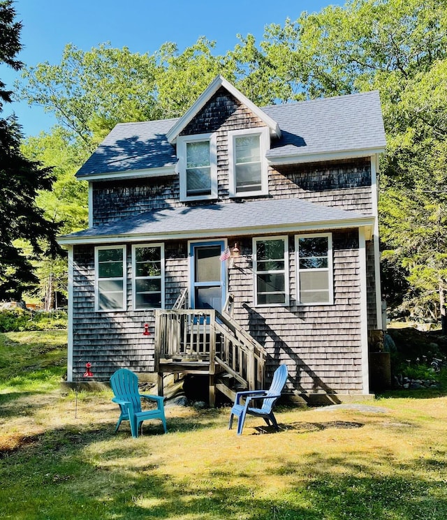 12 Spruce Gum Ln, Georgetown, ME 04548 - view of front of property with a front lawn and a shingled roof