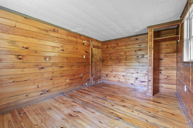 117 Taylor Woods Rd, Belgrade, ME 04917 - spare room featuring hardwood / wood-style floors and wood walls