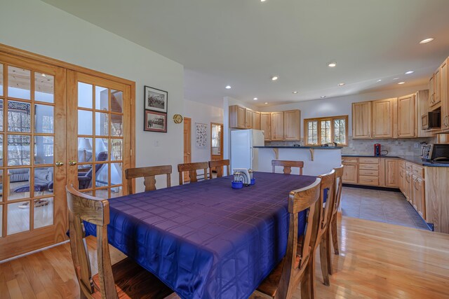 438 Oak Point Rd, Trenton, ME 04605 - dining space with french doors, light wood-type flooring, and recessed lighting