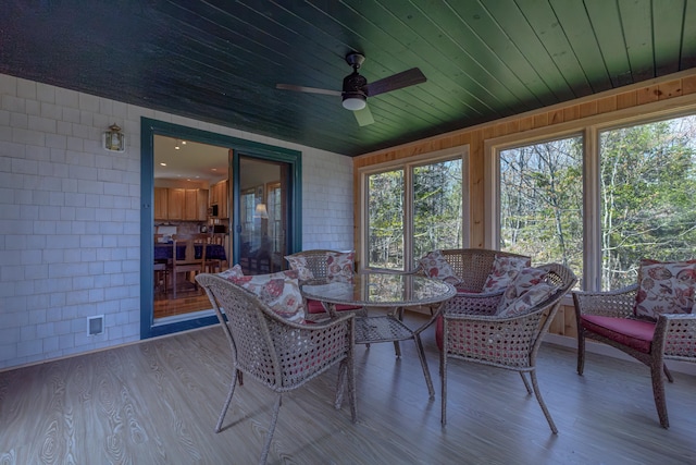 438 Oak Point Rd, Trenton, ME 04605 - sunroom with plenty of natural light, wood finished floors, wooden ceiling, and a deck