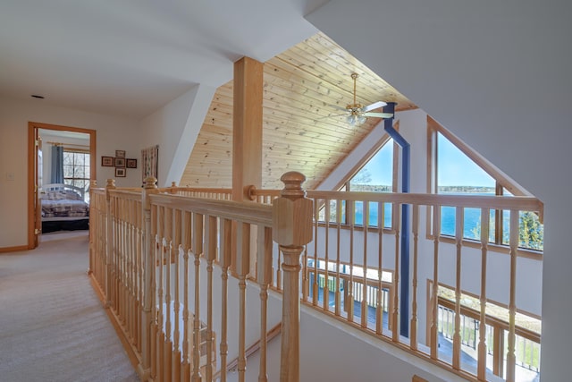 438 Oak Point Rd, Trenton, ME 04605 - corridor featuring a water view, an upstairs landing, light carpet, and baseboards