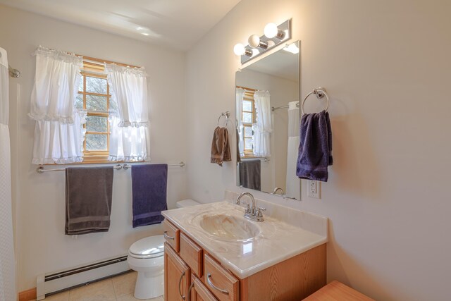 438 Oak Point Rd, Trenton, ME 04605 - full bathroom with a baseboard heating unit, toilet, healthy amount of natural light, and vanity
