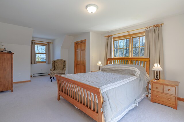 438 Oak Point Rd, Trenton, ME 04605 - bedroom with a baseboard heating unit, carpet floors, baseboards, and a closet