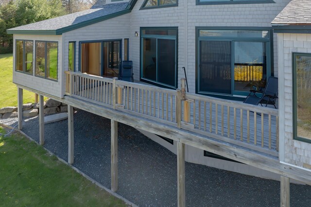438 Oak Point Rd, Trenton, ME 04605 - view of side of home with a wooden deck, a shingled roof, and a sunroom