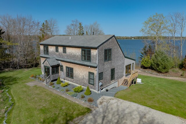 438 Oak Point Rd, Trenton, ME 04605 - view of front of house featuring a front lawn, a shingled roof, and a water view
