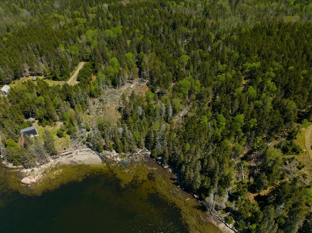 219 Willis Ln, Islesboro, ME 04848 - aerial view of property and surrounding area featuring a heavily wooded area and a nearby body of water