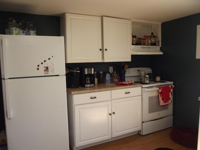 396 Waterville Rd, Norridgewock, ME 04957 - kitchen featuring white appliances, under cabinet range hood, white cabinetry, and light countertops