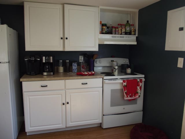 396 Waterville Rd, Norridgewock, ME 04957 - kitchen featuring white appliances, under cabinet range hood, electric panel, white cabinets, and wood finished floors