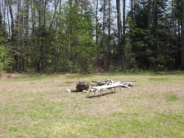 396 Waterville Rd, Norridgewock, ME 04957 - view of green lawn featuring an outdoor fire pit