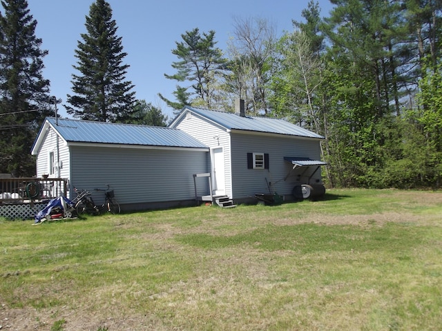 396 Waterville Rd, Norridgewock, ME 04957 - view of green lawn with entry steps and a deck