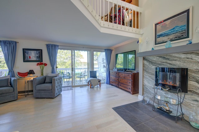 4 Goodridge Dr Unit 4, Naples, ME 04055 - living area with a fireplace and wood finished floors