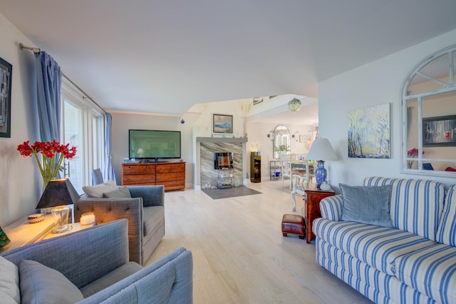 4 Goodridge Dr Unit 4, Naples, ME 04055 - living area with wood finished floors and a fireplace
