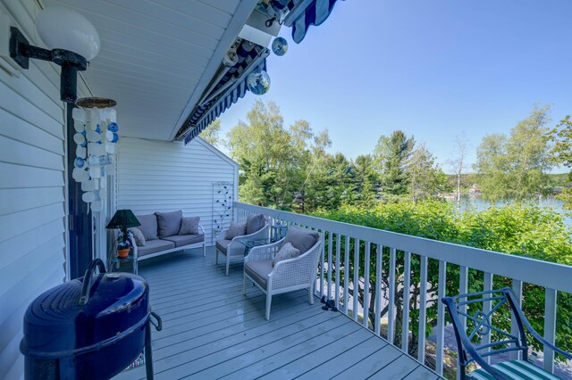 4 Goodridge Dr Unit 4, Naples, ME 04055 - wooden deck featuring an outdoor hangout area and a water view