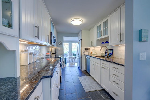 4 Goodridge Dr Unit 4, Naples, ME 04055 - kitchen with appliances with stainless steel finishes, a sink, decorative backsplash, and white cabinets