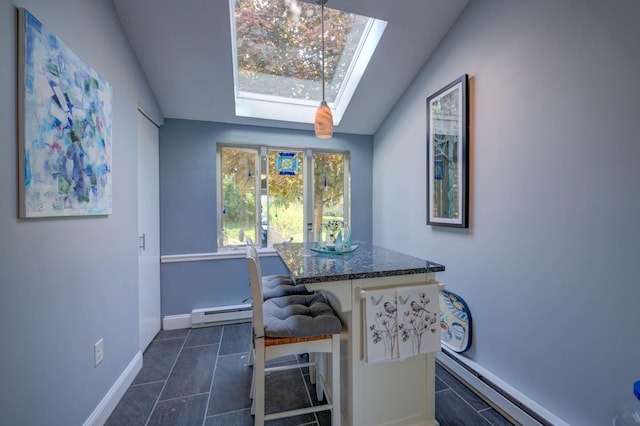 4 Goodridge Dr Unit 4, Naples, ME 04055 - dining space with a skylight, lofted ceiling, baseboard heating, baseboards, and dark tile patterned floors