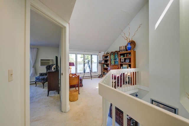 4 Goodridge Dr Unit 4, Naples, ME 04055 - corridor with carpet flooring, an AC wall unit, a baseboard heating unit, and an upstairs landing