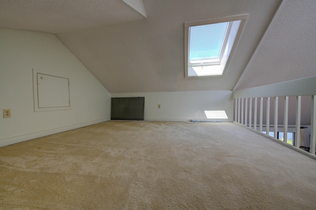 4 Goodridge Dr Unit 4, Naples, ME 04055 - bonus room with lofted ceiling, a skylight, carpet, and baseboards