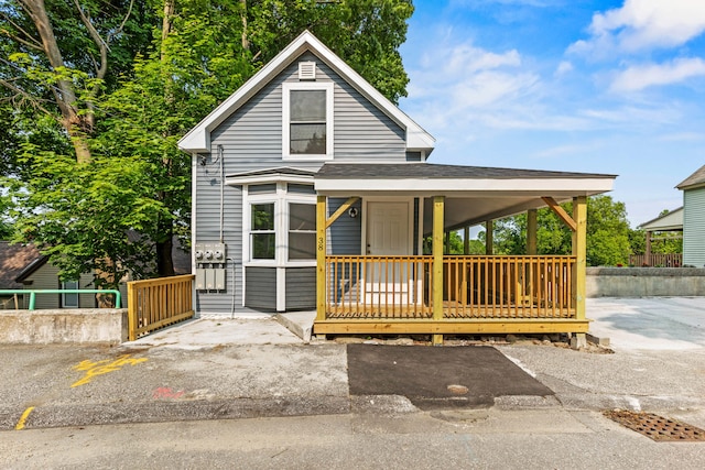 38 Newbury St, Auburn, ME 04210 - view of front facade with a shingled roof and a porch