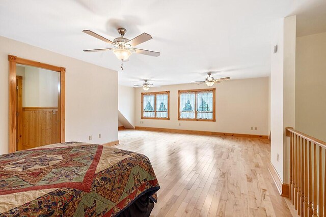 59 Lupine Dr, Belgrade, ME 04917 - bedroom with light wood-style flooring, a ceiling fan, and baseboards
