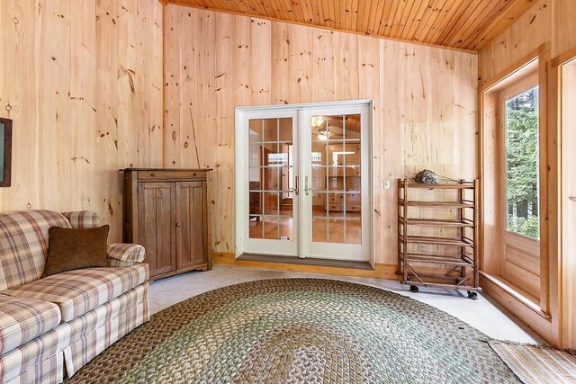 59 Lupine Dr, Belgrade, ME 04917 - sitting room with wooden walls, carpet, wooden ceiling, and french doors