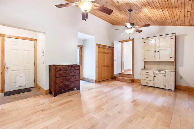 59 Lupine Dr, Belgrade, ME 04917 - unfurnished living room with ceiling fan, vaulted ceiling, baseboards, light wood-type flooring, and wooden ceiling