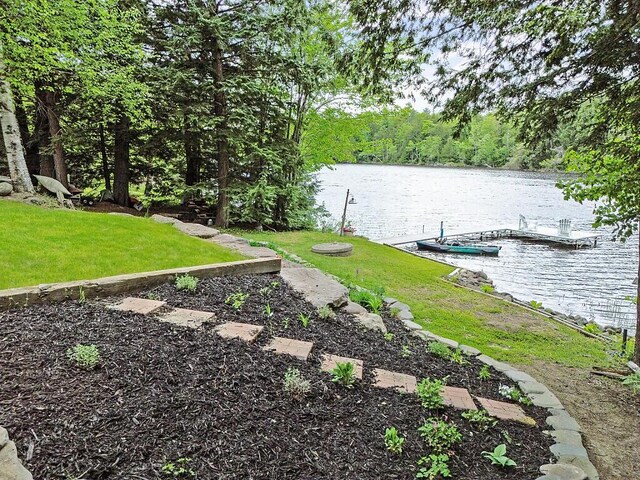 59 Lupine Dr, Belgrade, ME 04917 - view of green lawn with a water view, a floating dock, and a view of trees