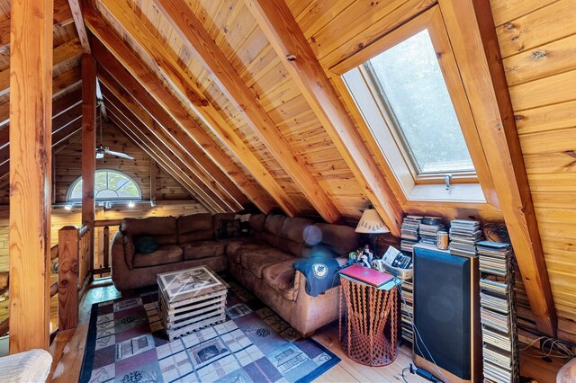 2451 Riverside Dr, Vassalboro, ME 04989 - living room featuring a skylight, wood finished floors, wooden ceiling, and wood walls