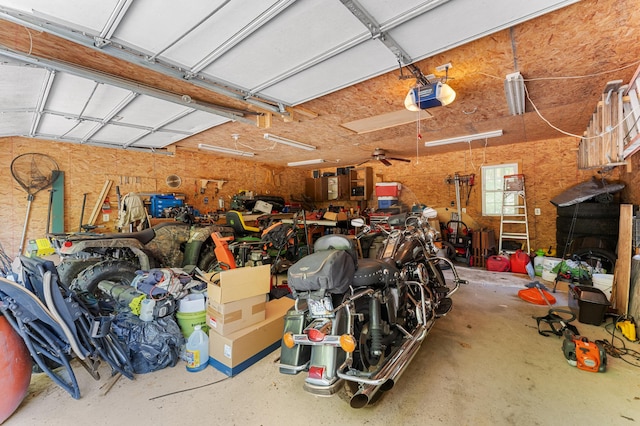 2451 Riverside Dr, Vassalboro, ME 04989 - garage featuring a garage door opener and a workshop area