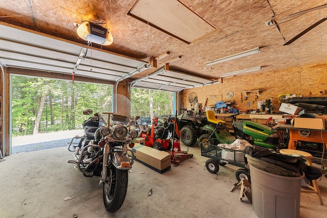 2451 Riverside Dr, Vassalboro, ME 04989 - garage featuring a garage door opener and a workshop area