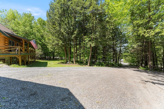 2451 Riverside Dr, Vassalboro, ME 04989 - view of yard with a deck and a view of trees
