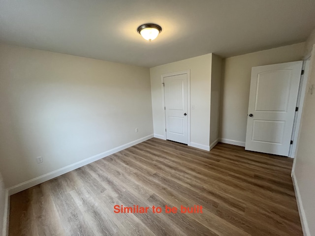 93 Union St, Orono, ME 04473 - unfurnished bedroom featuring wood finished floors and baseboards