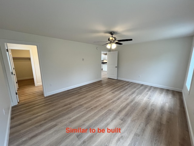93 Union St, Orono, ME 04473 - unfurnished room featuring wood finished floors, baseboards, and a ceiling fan