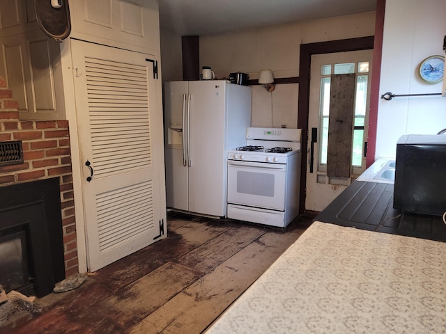 627 Waterville Rd, Skowhegan, ME 04976 - kitchen featuring white appliances and a brick fireplace