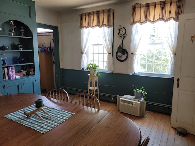 627 Waterville Rd, Skowhegan, ME 04976 - dining room with light wood finished floors and a wall mounted AC