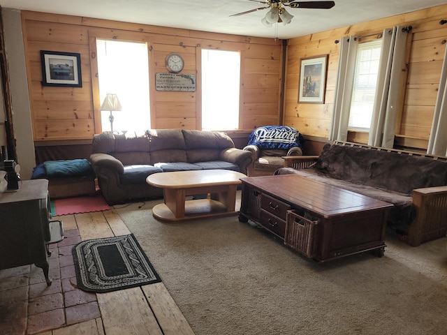 627 Waterville Rd, Skowhegan, ME 04976 - living room featuring healthy amount of natural light, ceiling fan, wood-type flooring, and wood walls