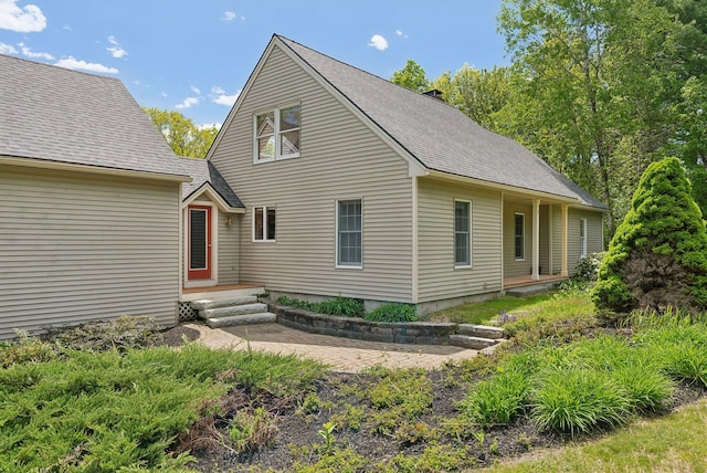 198 Range Rd, Cumberland, ME 04021 - view of front of property with roof with shingles and a chimney